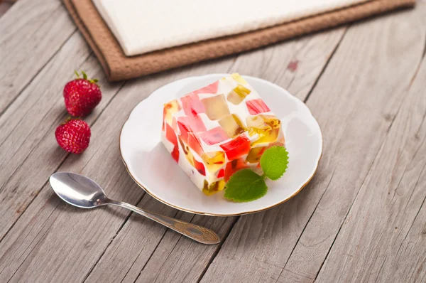 Fruit dairy, red and green jelly on a plate. — Stock Photo, Image