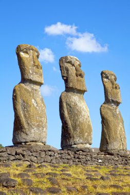 View of three of the seven Ahu Akivi Moai, which are the only Moai to face the sea, Rapa Nui, Easter Island, Chile. clipart