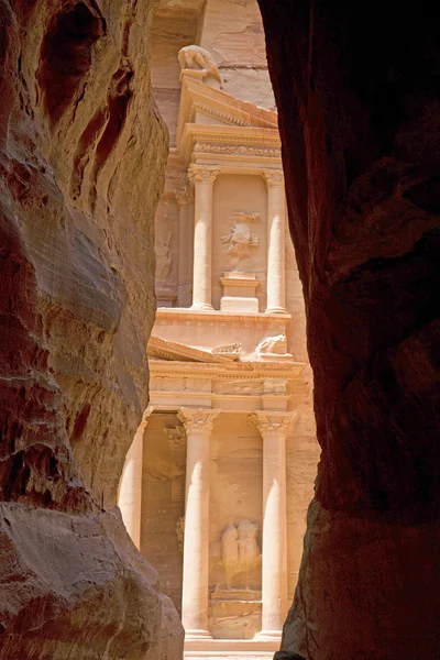 The first glimps of the Treasury (Al Khazneh) through the Siq, Jordan. Stock Image