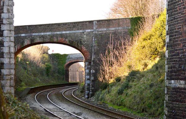 Railway arches over curved rails — Stock Photo, Image