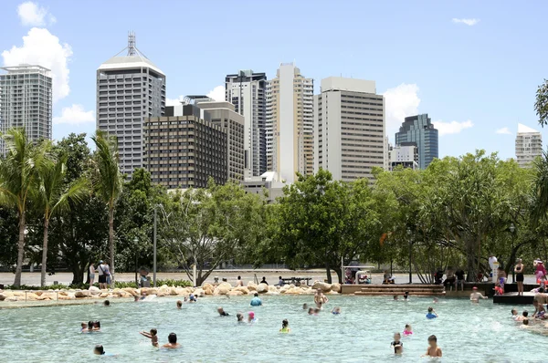 Brisbane skyline and people swimming in the water — Stock Photo, Image