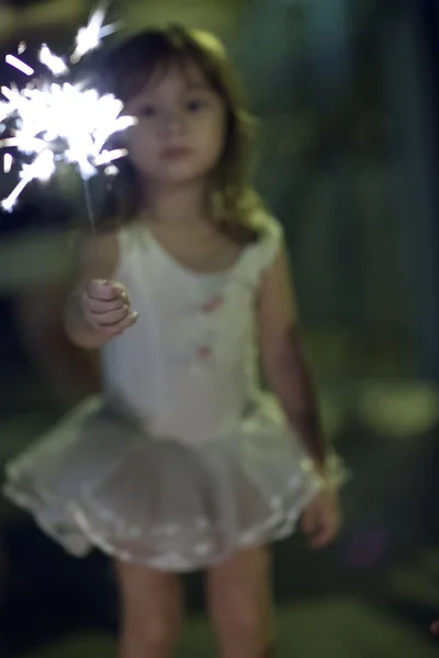 Girl with a sparkler — Stock Photo, Image