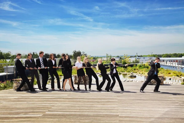 Business Teamwork People pulling on rope — Stock Photo, Image
