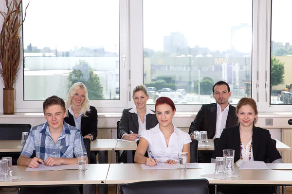 Businessgroup sitting in office — Stock Photo, Image