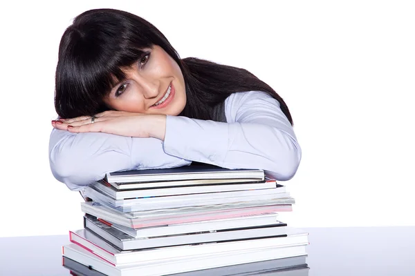 The teacher sits at a table with books — Stock Photo, Image