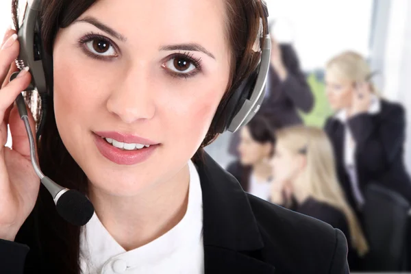 Businesswoman with headphones — Stock Photo, Image