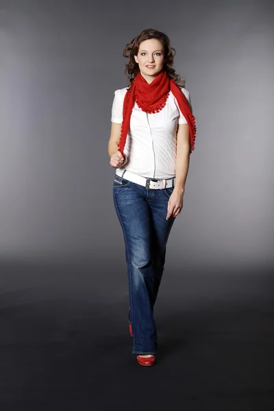 Brunette girl in a red scarf — Stock Photo, Image