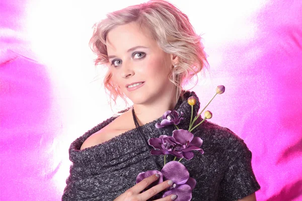 Girl with pink flowers on a white pink background — Stock Photo, Image