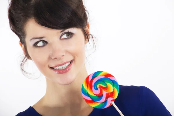 Brunette girl with a sweet candy — Stock Photo, Image