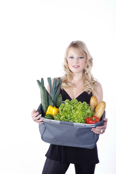 Blonde met een zak van voedsel — Stockfoto