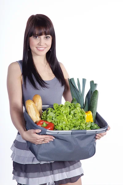 Brunette avec un sac de nourriture — Photo