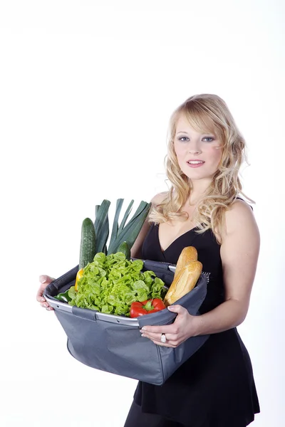 Blonde with a bag of food — Stock Photo, Image