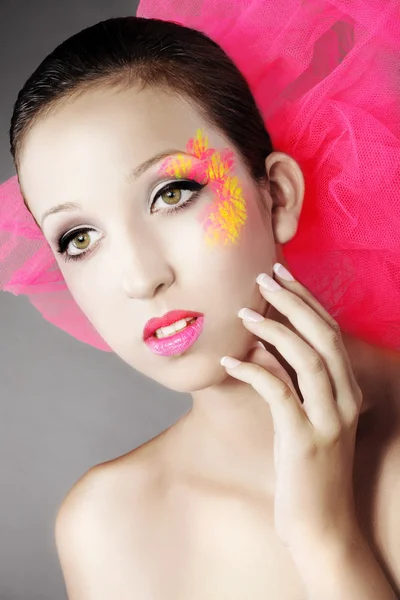 Brunette girl with a pink bow — Stok fotoğraf