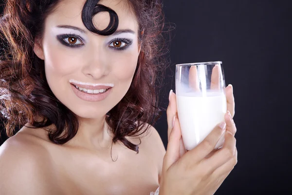 Brunette girl drinking milk — Stock Photo, Image