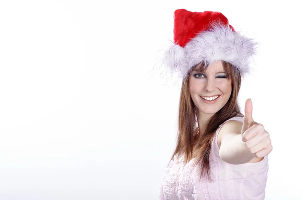 Christmas blonde girl shows a sign — Stock Photo, Image