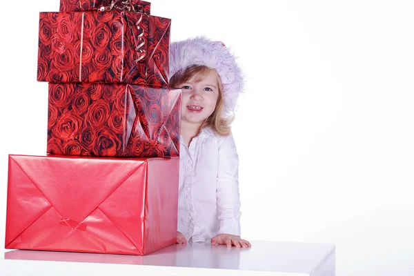 Young girl with Christmas gifts — Stock Photo, Image