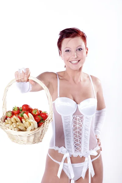 Girl in lingerie with a basket of fruit — Stock Photo, Image