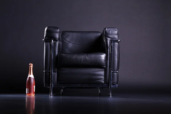 Chair with bottle of wine — Stock Photo, Image