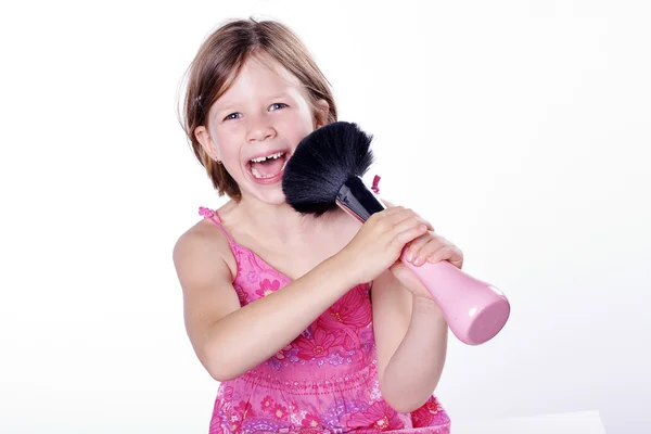 Little girl with a big plunger — Stock Photo, Image