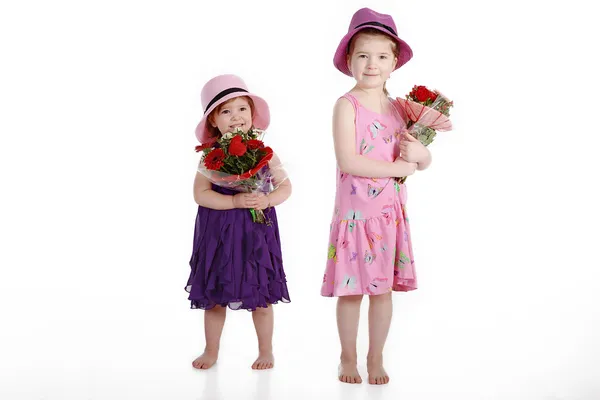 Two girls with bouquets — Stock Photo, Image