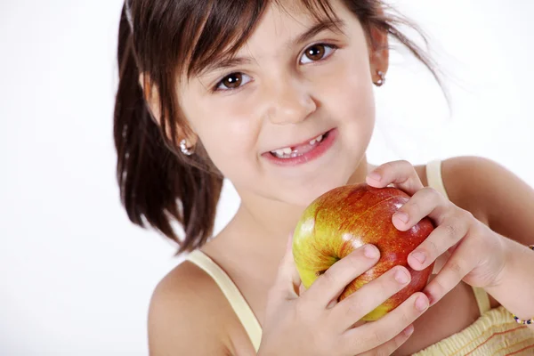 Little girl with a sweet apple — Stock Photo, Image