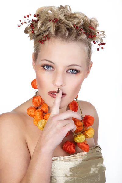 Blonde girl with dried plants shows the sign — Stock Photo, Image