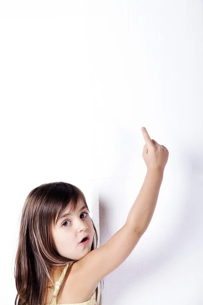 Little girl shows a finger up — Stock Photo, Image