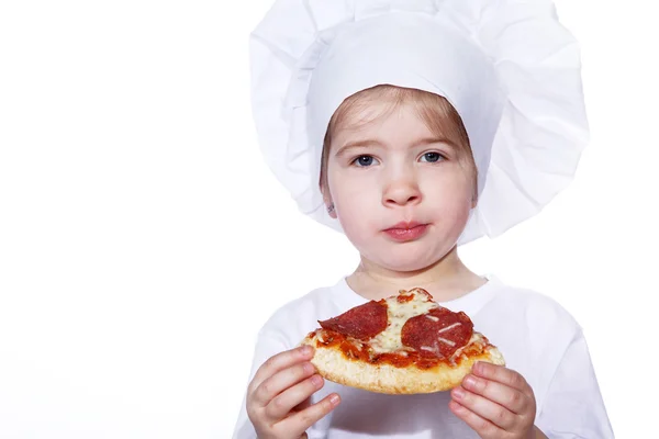 Cook girl eating pizza — Stock Photo, Image