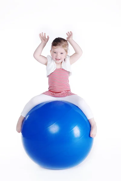 Little girl with big blue ball — Stock Photo, Image