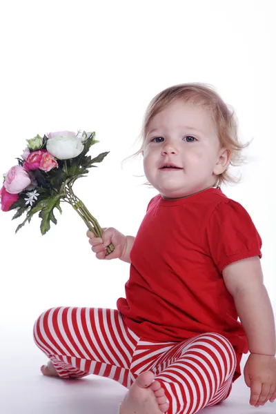 Bambina con un mazzo di fiori — Foto Stock