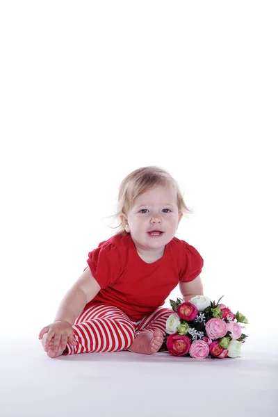 Little girl with a bouquet of flowers — Stock Photo, Image