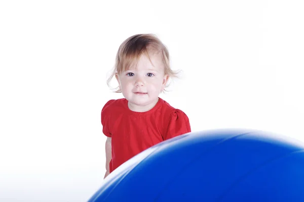 Little girl with big blue ball — Stock Photo, Image