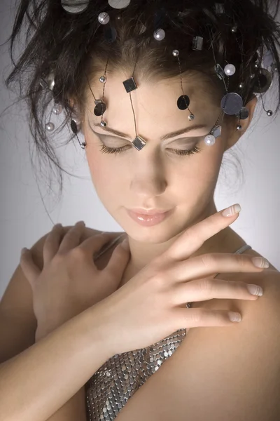 Brunette girl with lights on the head — Stock Photo, Image