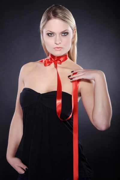 Blonde girl with red ribbon — Stock Photo, Image