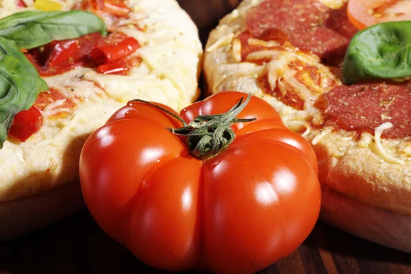 Tomato with pizzas — Stock Photo, Image