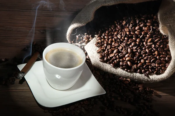 Coffee with sack of coffee beans — Stock Photo, Image