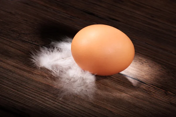 Egg on a wooden table — Stock Photo, Image