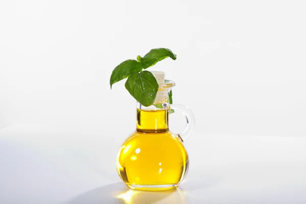 Oil in a glass bottle — Stock Photo, Image