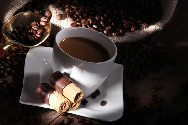 Coffee with sack of coffee beans — Stock Photo, Image