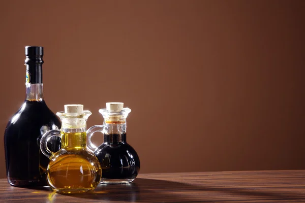 Oil in a glass bottle — Stock Photo, Image