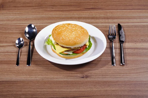 Hamburger on the plate — Stock Photo, Image