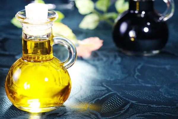 Oil in a glass bottle — Stock Photo, Image