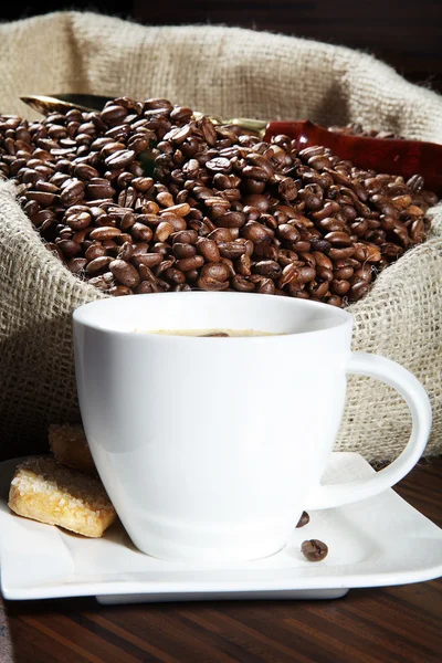 Coffee with sack of coffee beans — Stock Photo, Image