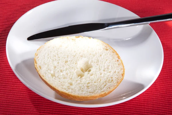 Bread with a fork on a plate — Stock Photo, Image