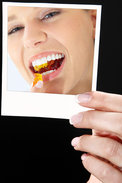 Woman's hand with a photo