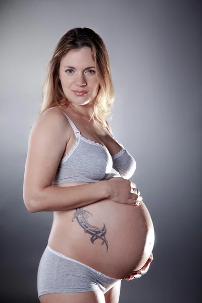 Pregnant blonde girl in underwear — Stock Photo, Image