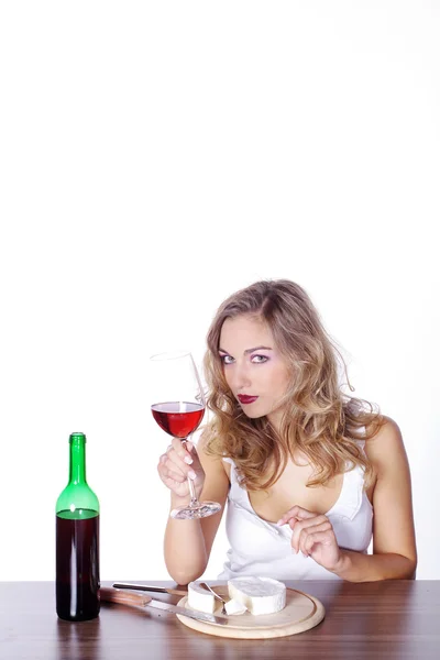 Blonde girl having lunch with wine — Stock Photo, Image