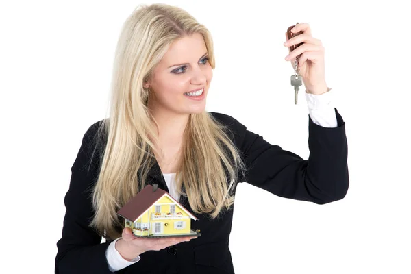 Blonde girl with a toy house and key — Stock Photo, Image