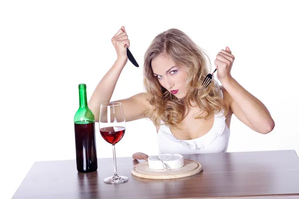 Blonde girl having lunch with wine — Stock Photo, Image