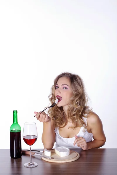 Blonde girl having lunch with wine — Stock Photo, Image